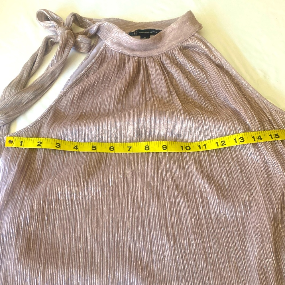 Women’s halter light pink metallic INC lined top. Bow detail for tying💗